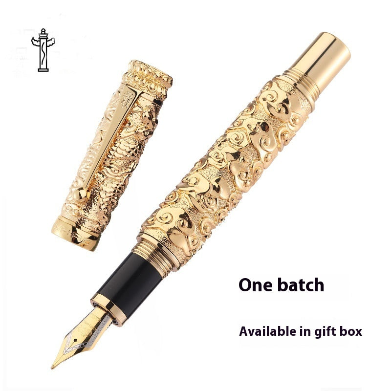 Decorative gold pen with intricate designs on a white background
